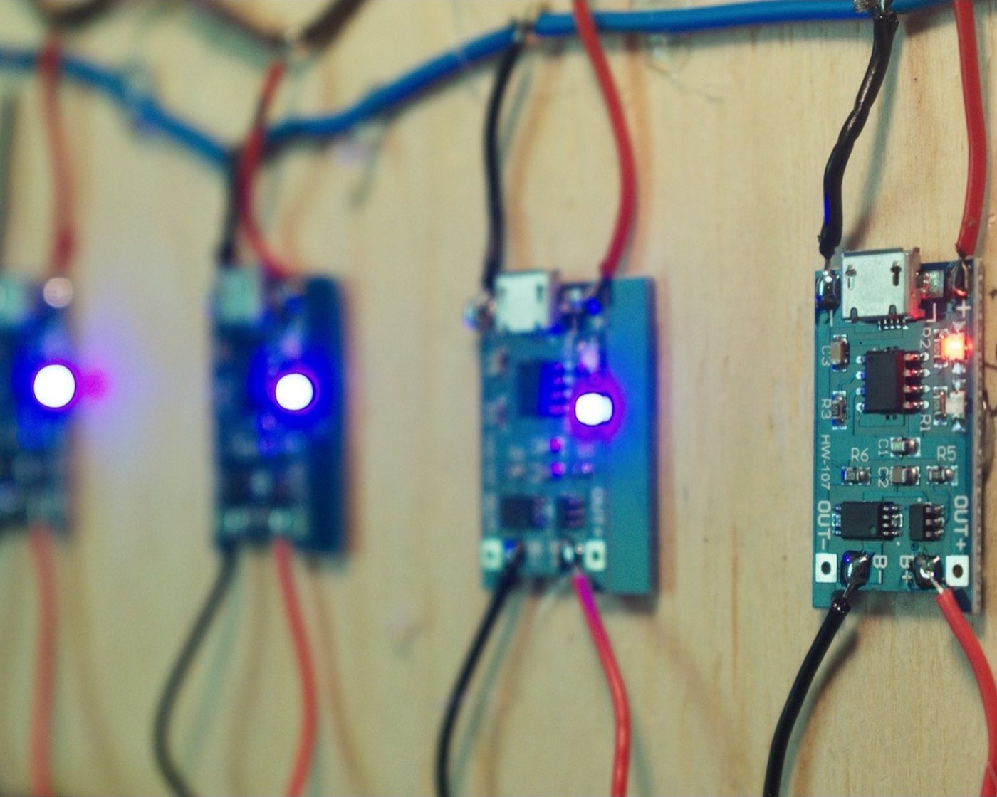 A group of green circuit boards on a work surface