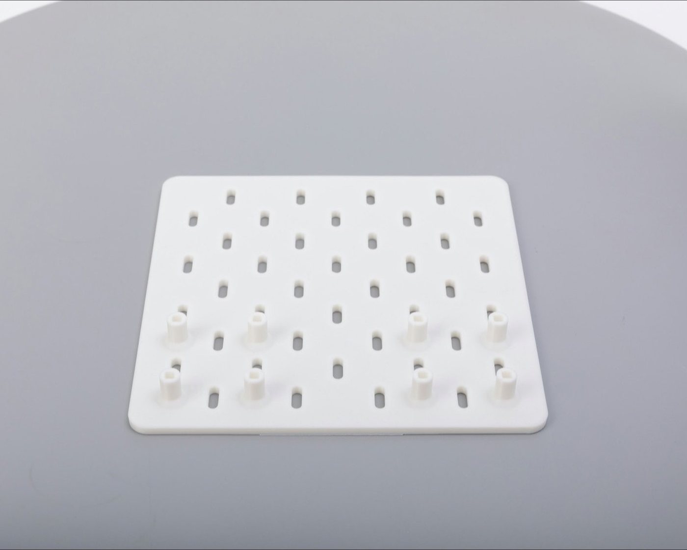 A pegboard with empty pegs waiting to be filled